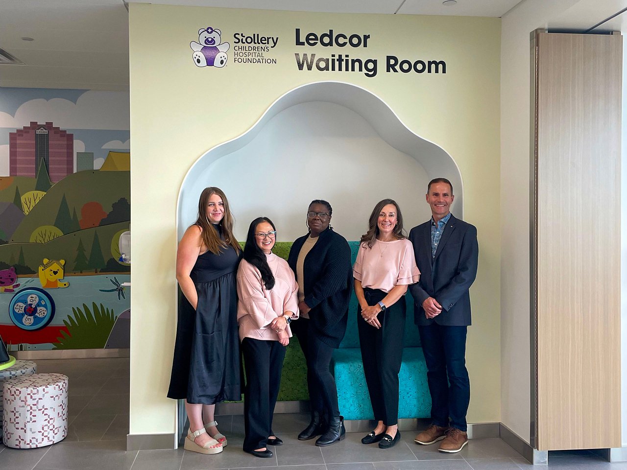 A group of Ledcor and Stollery Hospital personnel posing for a photograph